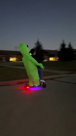 Riding my e scooter with a alien abduction costume