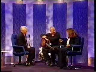 From the archives: Mark's interview with Parkinson in 2000, during which he played snippets from 'Money For Nothing', 'Romeo & Juliet', 'Baloney Again', and discusses the first time he tried to amplify his guitar. | Mark Knopfler