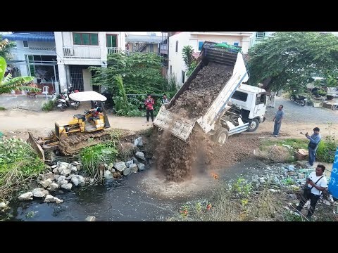 Powerful Bulldozer and Dump Truck: Major Groundworks Project Transforming the Landscape