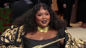 33K views · 1.5K reactions | Musician Lizzo, who trained as a classical flute player, made an entrance at the glitzy annual Met Gala, playing a gold flute as she walked the red carpet | Reuters | Facebook