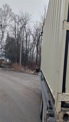Exactly Where He Wanted It Delivered this container to a customer’s property after he picked it up at auction in Trenton. Tight access and muddy ground, but we made it work. Snuck the truck in with just enough room, got it lined up, and set it down: • Blocks at the back • Slid the deck out • Set the front down onto cinder blocks Right where he wanted it. Happy customer at the end of it. #flatbed #towmandan #towtrucklife #tow #shippingcontainer