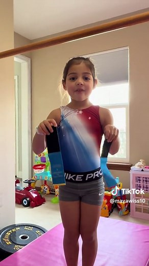 This video is a step-by-step XCEL Bronze bar routine tutorial taught by a five-year-old gymnast who is learning and mastering her USA Gymnastics XCEL Bronze uneven bars routine. In this beginner-friendly gymnastics tutorial, she breaks down each skill in her Bronze bar routine—including the mount, pullover, cast, back hip circle, squat-on, jump to high bar, long hang, and dismount—in a simple way that other young gymnasts and parents can easily follow. Perfect for beginner gymnasts, XCEL Bronze