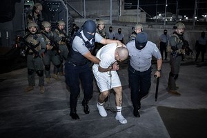 El Salvador moves suspected gang members to new 'mega prison' amid human rights criticism