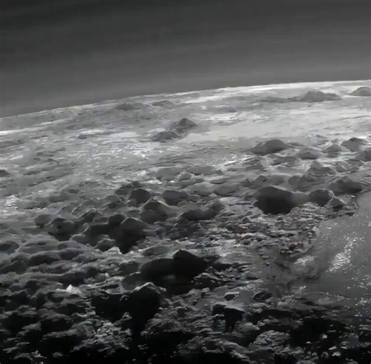 July 14, 2015. This sequence is a digital reconstruction of the historic New Horizons flyby, rendered from the spacecraft’s Long Range Reconnaissance Imager data.After a nine year journey, the probe passed within 7,800 miles of Pluto’s surface, capturing these water-ice mountains rising 11,000 feet into a nitrogen atmosphere. The distinct haze visible on the horizon is a genuine atmospheric phenomenon, caused by the solar processing of methane and nitrogen. While the motion is synthesized from s