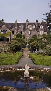 Along the winding roads from Aberystwyth and into Gwynedd in North Wales, Snowdonia’s mighty peaks come closer into view. Just past the market town of Dollgelau, the Penmaenuchaf hotel appears elegantly perched above the river Mawddach, backed by thick woodlands and black mountains zig-zagging across the sky. The handsome Victorian mansion has just been given a new lease of life by interior designer @nicolahardingandco, who has brought her signature colour show to its bedrooms and panelled bar, 