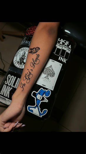 In God’s Hands ✨ Fine line script with a soft butterfly accent — a timeless reminder of faith, trust, and protection. Clean lettering, smooth flow, and intentional placement make pieces like this truly personal. If this style speaks to you, let’s create something meaningful together. 📲 Text or WhatsApp 1 (868) 346-5116 for bookings & inquiries. #ScriptTattoo #FineLineTattoo #FaithTattoo #MinimalTattoo #InkedInnovations