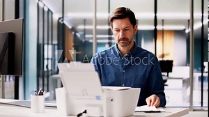 Young Businessman Using Photocopy Machine