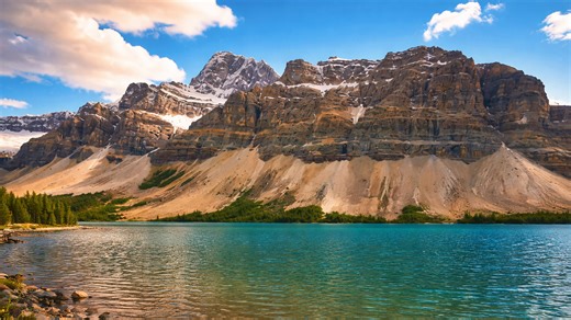 Mountain peaks reflected on Bow Lake in Canada
