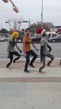 Talented Street Performer Dances in Synchronization with his Puppets