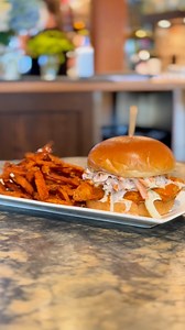 Say hello to the Buffalo Crispy Chicken Burger. Crispy chicken tossed in housemade buffalo sauce, topped with blue cheese dressed slaw, all stacked on a toasted brioche bun. It’s spicy, tangy, and totally irresistible. See our whole menu at thenewsroompub.com. | The Newsroom Pub