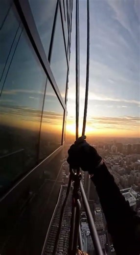POV High-Rise Window Cleaner Survives Sudden Wind Gust 80 Stories Up