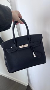 HERMÈS ICONS: Black Birkin 30🖤 We love how the grainy Togo leather construction is contrasted beautifully with shiny palladium-finish hardware. Handstitched by highly skilled artisans in the year 2010, this Hermès Birkin will fit everything you need and keep your style elevated. A true timeless investment✨ #preloved | The Luxury Closet