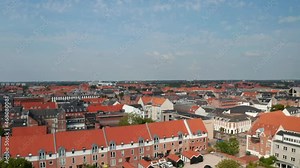 Aerial view flight nearby the Water Tower, historical monument of Esbjerg, Denmark. Drone view moving towards revealing amazing skyline of the city and Torvet square with the statue of Christian IX
