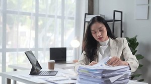 Woman Sitting Desk Pile Papers Front Stock Footage Video (100% Royalty-free) 3708047511 | Shutterstock