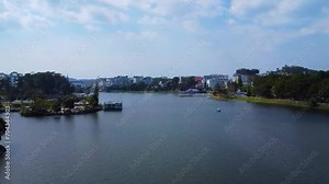 Aerial panorama view of Sunflower Building at Lam Vien Square in Da Lat City. Tourist city in developed Vietnam. Center Square of Da Lat city with Xuan Huong lake. Travel and landscape concept.
