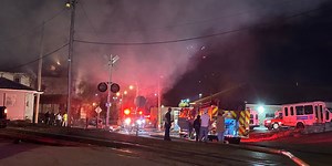 Crews are battling a structure fire on 6th Street in Parkersburg