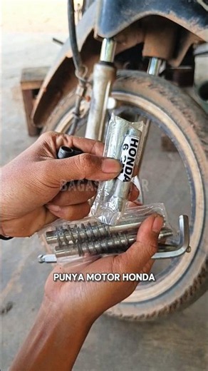 Raising motorcycle front shocks with a fork extension adapter