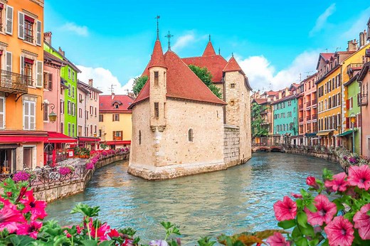 This French Town Is Known as the ‘Venice of the Alps’ With Beautiful Canals, a Turquoise Lake, and Michelin-starred Restaurants