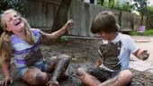 Eight year old twins mud fight - laughing it up