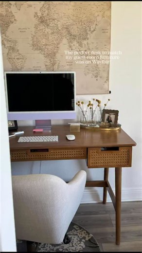 Emily | Home Decor | DIY on Instagram: "The perfect home desk does exist 🙌 Found this one on Wayfair, and it ties in perfectly with the rest of my cane guest bedroom furniture. The 51” top gives me plenty of space for my desktop and notes, and those cane-front drawers make it feel like it belongs in the room—not just a random work corner. Bonus: I linked the desk, rug, art, and chair on my LTK so you can recreate the look! Comment SHOP below to receive a DM with the link to this post on my LTK 