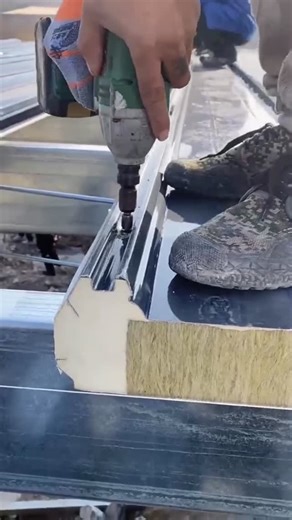 Jinyao Sandwich panels on Instagram: "🔥 Jinyao Steel: Trending 2026! Polyurethane Edge-Sealed Rockwool Roof Panel Installation! 🏗️ Witness the viral 2026 roof panel installation—our polyurethane edge-sealed rockwool sandwich panels take center stage! 🧱 Superior thermal insulation, fire resistance, and weatherproof performance make them perfect for steel factory roofs. Jinyao’s global one-stop service: custom design, production, worldwide shipping & on-site installation, meeting global industr