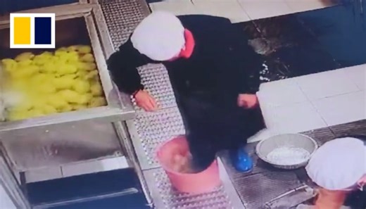 School canteen worker in China found stepping on ingredients with boots
