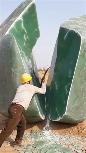 Cracking open a massive jade stone in the river