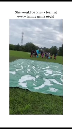 Koala on Instagram: "Follow mee friends?.......The video features a lively outdoor event where a group of people is participating in a competitive drinking game combined with a slip-and-slide. The focus is on a woman who shows incredible speed and determination to win her round. ​Detailed Visual Breakdown ​The Race Begins: The video starts with several people lined up at the edge of a large, green plastic tarp spread across a grassy field. The tarp is covered in water and soap to make it slipper