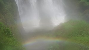 Download Great water fall on the tropical forest, water stream and splash water when rainy season. The footage is suitable to use for adventure content media, nature and forest footage background. for free