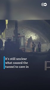 Indian workers trapped in a collapsed Himalayan road tunnel for nearly 10 days were seen alive on camera for the first time when rescuers made a breakthrough by pushing in a six-inch wide pipe: | DW News