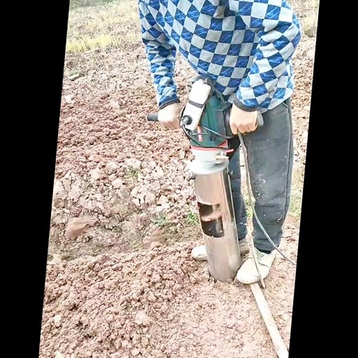 Manual Post Driver Use in Outdoor Settings