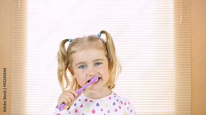 Little girl brushing her teeth . dental hygiene. happy little girl brushing her teeth Stock Video