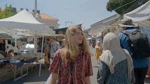 Woman Strolling Through a Bustling Street Market - Free Stock Video Footage | Coverr