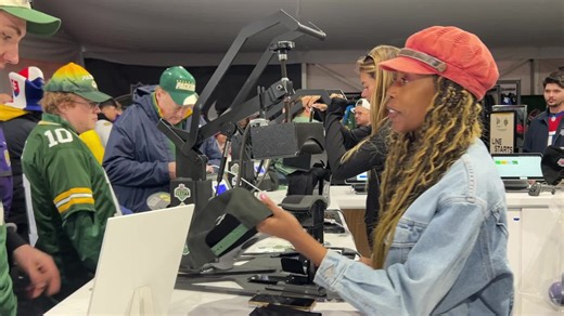 See how custom hats are made inside the NFL Draft Shop tents in Green Bay