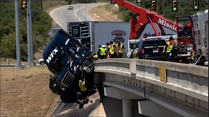 Big rig hangs off San Antonio bridge, briefly closing multiple Loop 1604 lanes