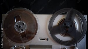 The reels of a 1970s vintage reel-to-reel tape deck turn as the analog counter advances. The tape is moving at 7-1/2 inches per second.