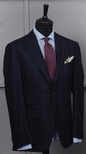 A navy check jacket naturally prompts the question of what to wear below the waist. While classic wisdom often reaches straight for green, it can be a surprisingly difficult shade in wool. If you are set on green, moleskin is a dependable choice, but corduroy is the true standout. Its rich texture and ability to hold colour make it an excellent partner for a navy check, offering a refined yet characterful look. #tailoringtips #mensstyle #britishmenswear #smartcasualstyle #rampleyandco | Rampley 