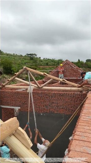 Without a crane, this is how they installed the roof trusses.