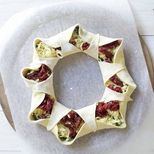 This glorious sun-dried tomato basil mozzarella pastry wreath is such a great appetizer for everything from Festive parties to Game Day feasting. Recipe here: http://simply-delicious-food.com/sun-dried-tomato-basil-pastry-wreath/ | Simply Delicious