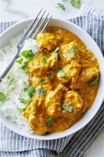 Served over steamy white rice, this one-pan chicken curry is easy enough for a cozy weeknight dinner. Recipe: https://natashaskitchen.com/chicken-korma/ | NatashasKitchen.com