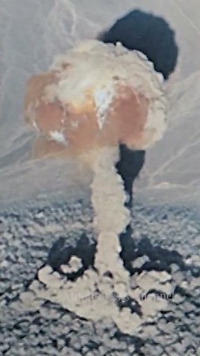 Aerial view of atom bomb blast fireball and cloud