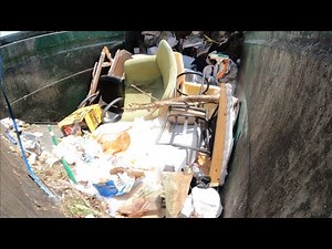 Waste Management front load garbage truck hopper view
