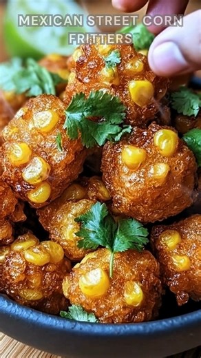 Corn mixed with chili, garlic, and paprika. Stir in flour, eggs, and cilantro. Fry spoonfuls in hot oil for 2–3 minutes per side until golden and crisp. Finish with a drizzle of crema, crumbled Cotija, and a squeeze of lime crispy, tangy, and bursting with smoky-sweet corn flavor. 🌽✨ Ingredients ➤ 2 cups corn kernels (fresh, frozen, or canned) ➤ 1/2 cup all-purpose flour ➤ 1/4 cup cornmeal ➤ 1/4 cup grated Parmesan cheese ➤ 1 tsp baking powder ➤ 1/2 tsp chili powder ➤ 1/2 tsp garlic powder ➤ 1/