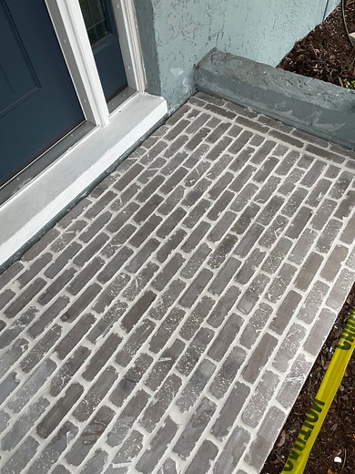 How to Install Thin Brick on a Cement Front Porch Walkway