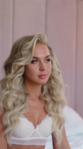 Beautiful Woman with Blonde Wavy Hair Posing Indoors