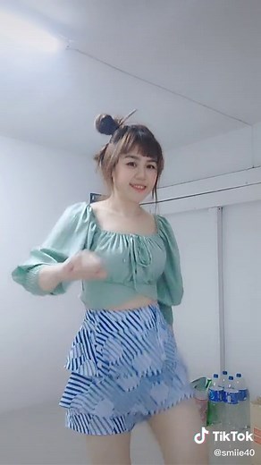 Fun Dance Moves in Green Cropped Top and Striped Shorts