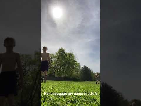 Shirtless boys playing soccer