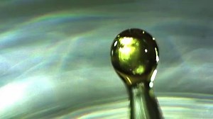 Water drops or planetary collision in slow motion