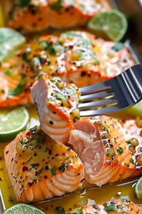 🔥 **Lime Garlic Butter Salmon** Juicy, pan-seared salmon fillets bathed in a vibrant lime-garlic butter sauce, finished with fresh herbs. Bright, simple, and packed with flavor — perfect for an easy yet elegant meal. **Ingredients** **For the Salmon:** • 4 salmon fillets • Salt & black pepper to taste • 1 tbsp olive oil **Lime Garlic Butter Sauce:** • 3 tbsp butter • 3 garlic cloves, minced • Juice of 2 limes • Zest of 1 lime • 1 tsp honey (optional, for balance) • Red pepper flakes (optional) 