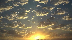 Sunset In The Sky With Clouds